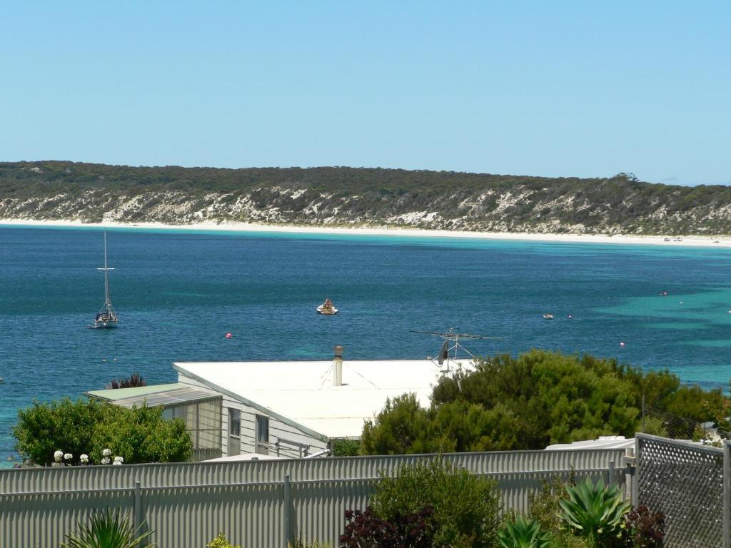 a view of a beach with a house and the ocean at Fareview Beach House in Emu Bay