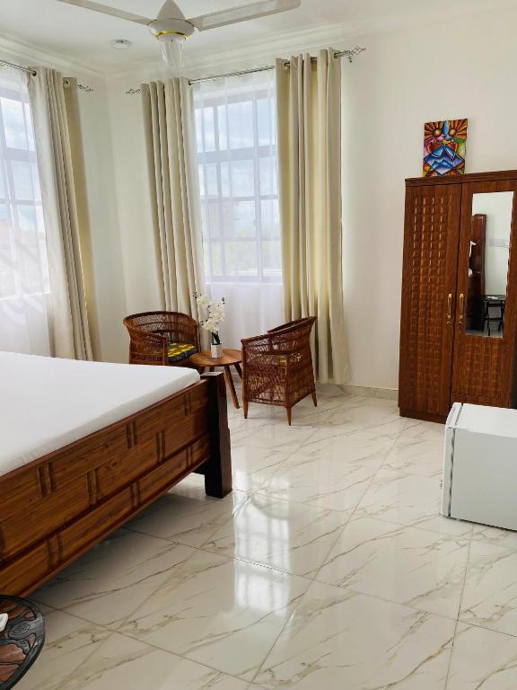 Postel nebo postele na pokoji v ubytování Terry's Villa Nungwi