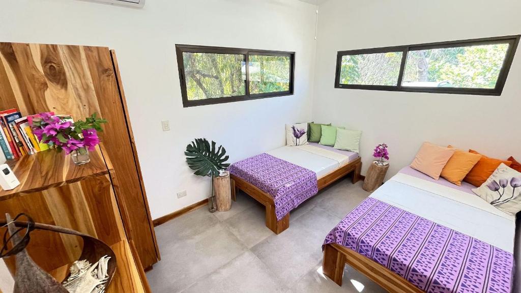 Postel nebo postele na pokoji v ubytování Villas Roma Del Mar