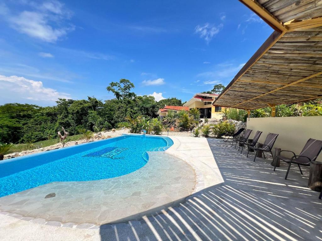 Bazén v ubytování Villas Roma Del Mar nebo v jeho okolí