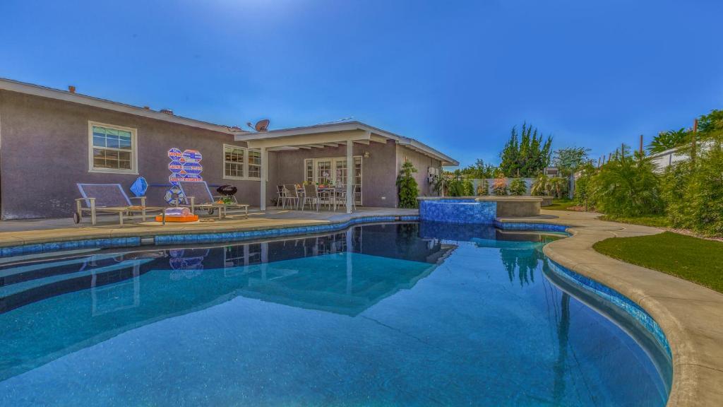 a swimming pool in front of a house at F-53 Trenton in Anaheim