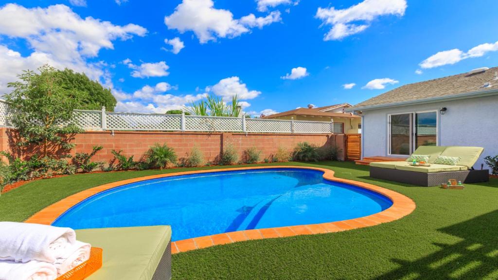 a swimming pool in the yard of a house at F-52 Trenton II in Anaheim