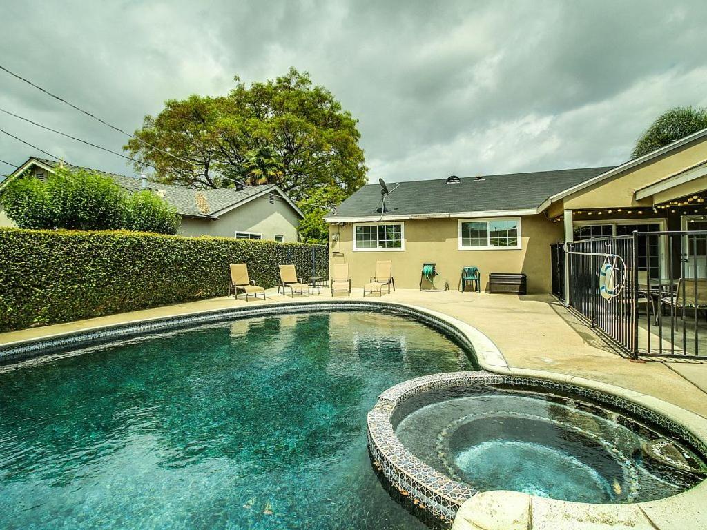 a swimming pool in front of a house at F-29 The Pirates Cove in Anaheim