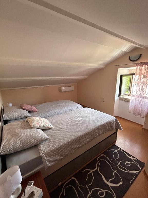 Postel nebo postele na pokoji v ubytování Apartman Luka