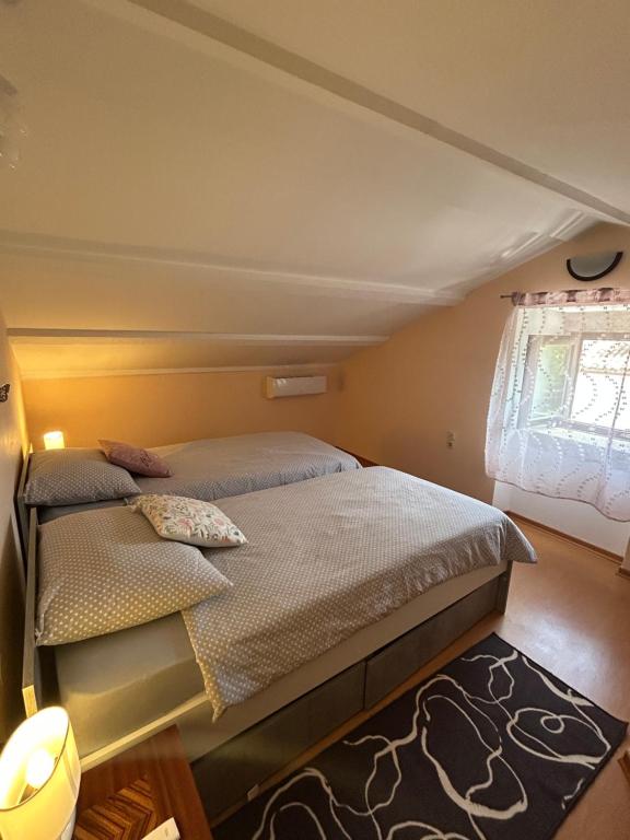 Postel nebo postele na pokoji v ubytování Apartman Luka