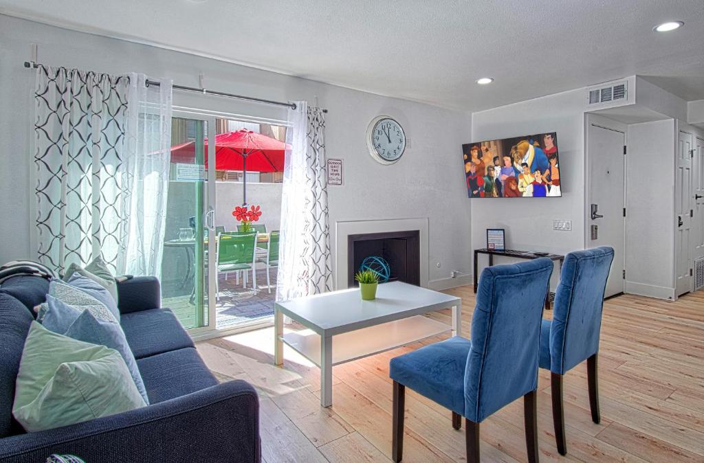 a living room with a couch and a table at New Suite Escapes 5 by Funtierland Vacation Rentals in Anaheim