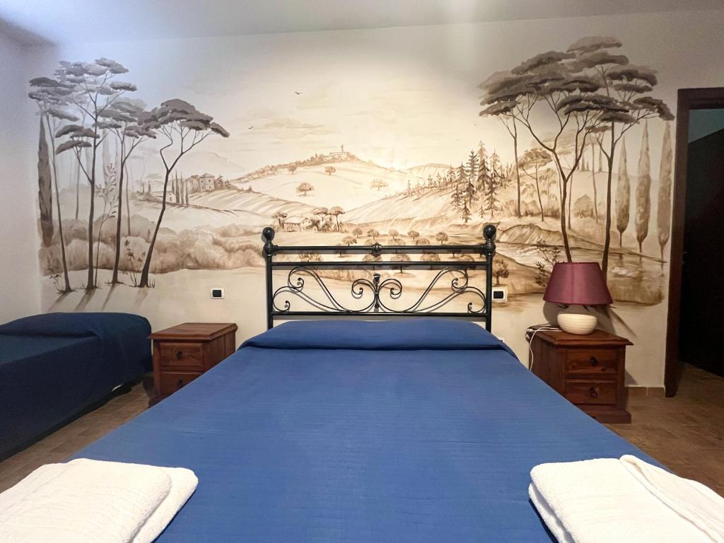Postel nebo postele na pokoji v ubytování Agriturismo B&B La Sterpina