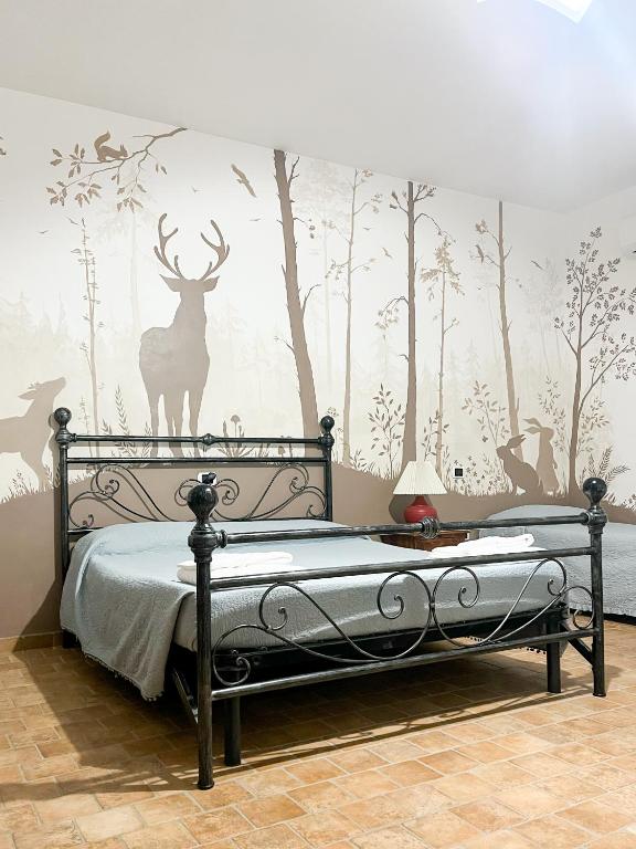 Postel nebo postele na pokoji v ubytování Agriturismo B&B La Sterpina
