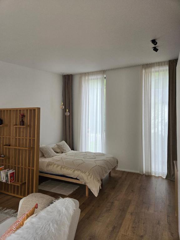 Postel nebo postele na pokoji v ubytování Le Refuge de Franchimont