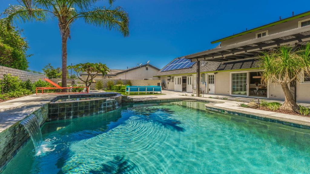 a swimming pool in front of a house at F-51 Orangewood in Anaheim