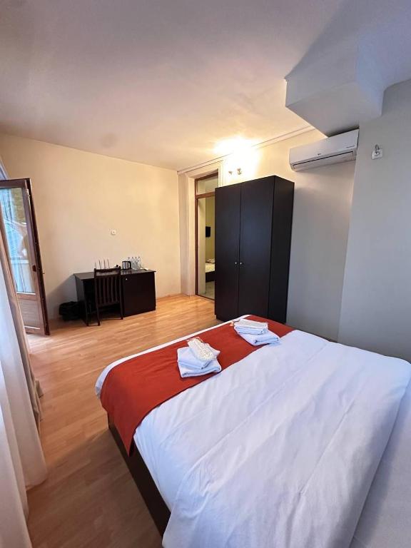 Postel nebo postele na pokoji v ubytování Hotel New Terrace