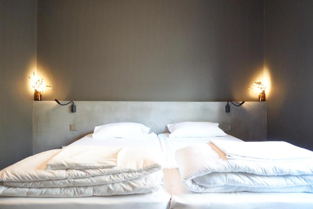 Postel nebo postele na pokoji v ubytování So Young Hostel