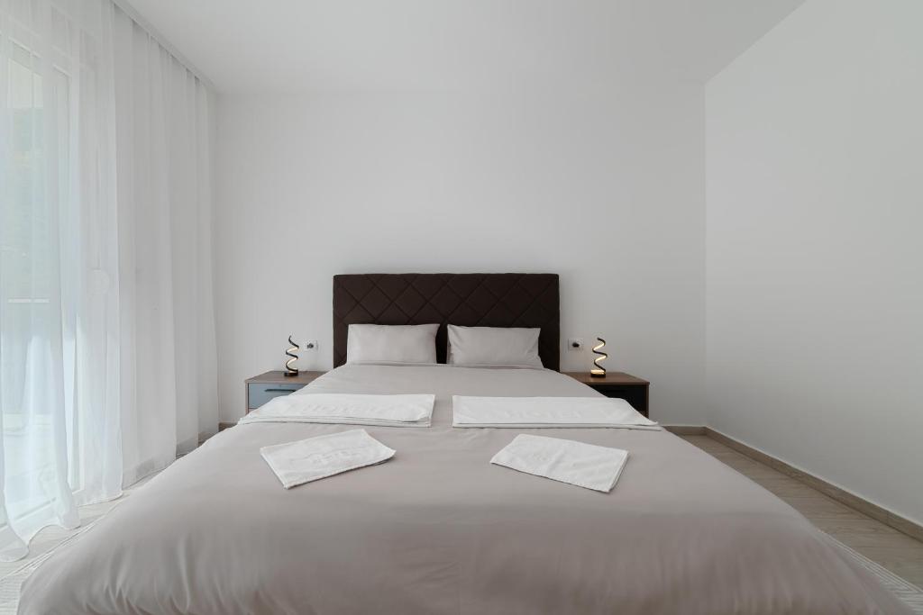 Postel nebo postele na pokoji v ubytování MM Apartments Gray