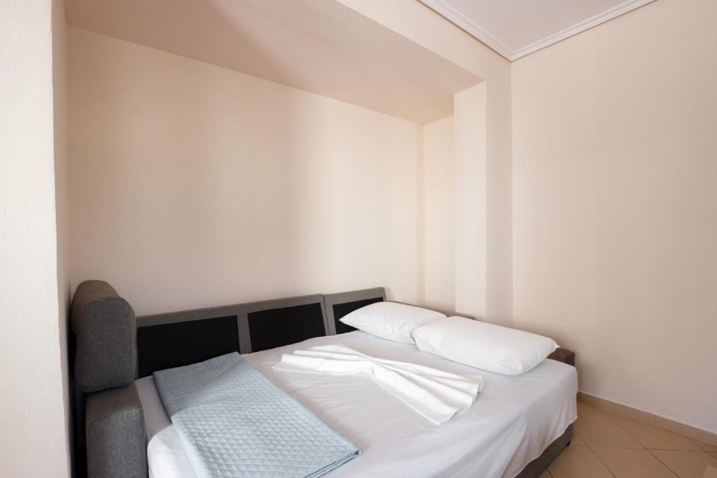 Postel nebo postele na pokoji v ubytování Ariadne 7 Apartments