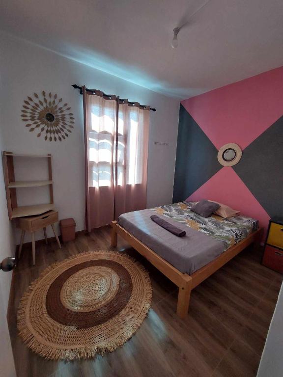 Postel nebo postele na pokoji v ubytování Location saisonnière Caza Villana