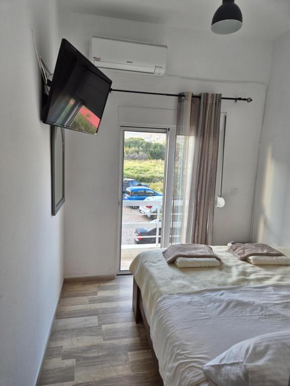 Postel nebo postele na pokoji v ubytování Anastasia Beach House Haraki
