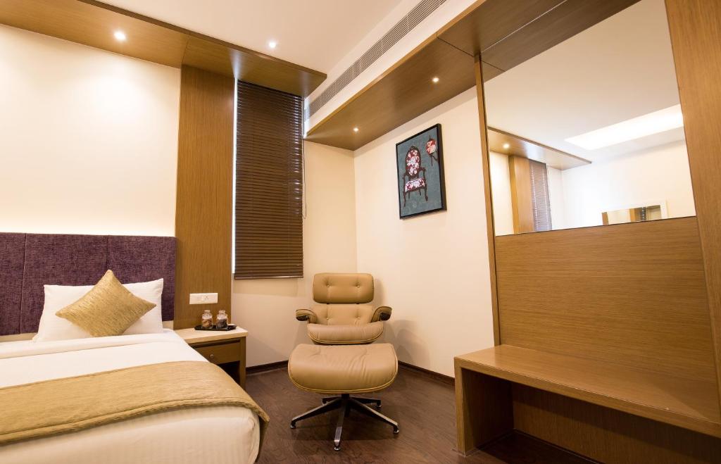 Postel nebo postele na pokoji v ubytování Kiscol Grands Hotel