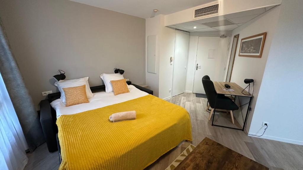 Ένα ή περισσότερα κρεβάτια σε δωμάτιο στο Appartement O'501