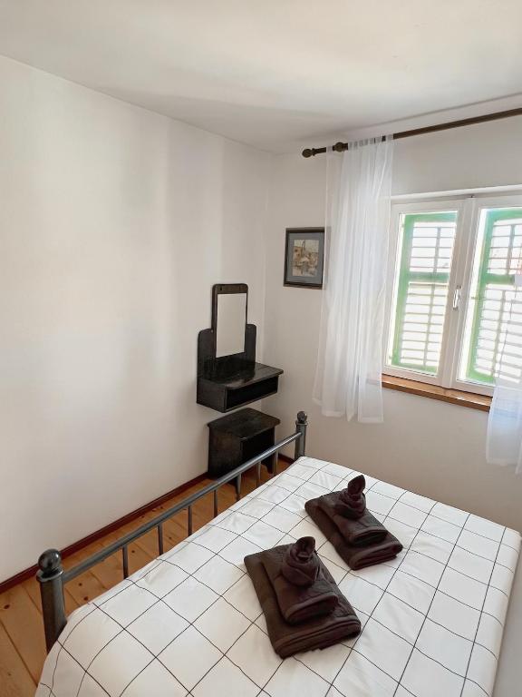 Posteľ alebo postele v izbe v ubytovaní Apartment Dalmatera