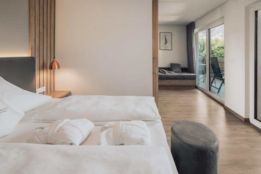 Postel nebo postele na pokoji v ubytování Hotel Lisetta