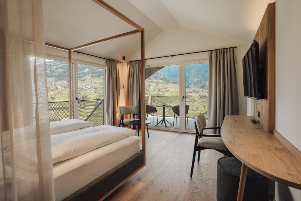 Postel nebo postele na pokoji v ubytování Hotel Lisetta