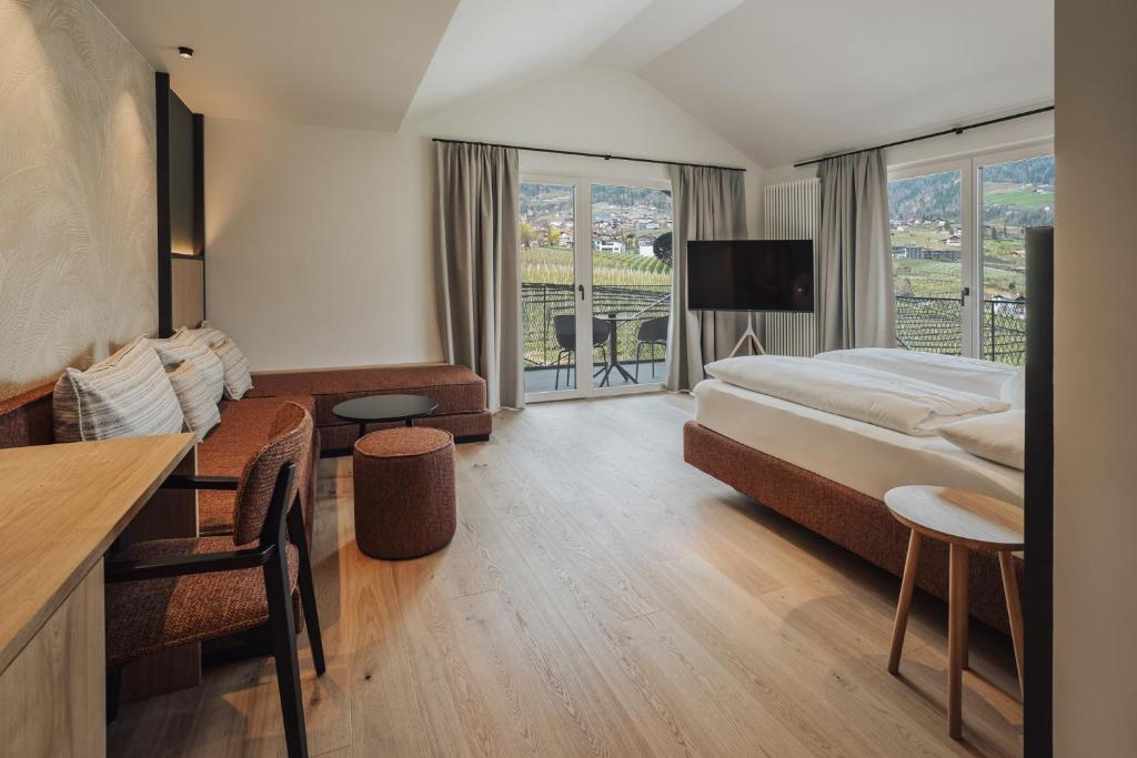 Postel nebo postele na pokoji v ubytování Hotel Lisetta