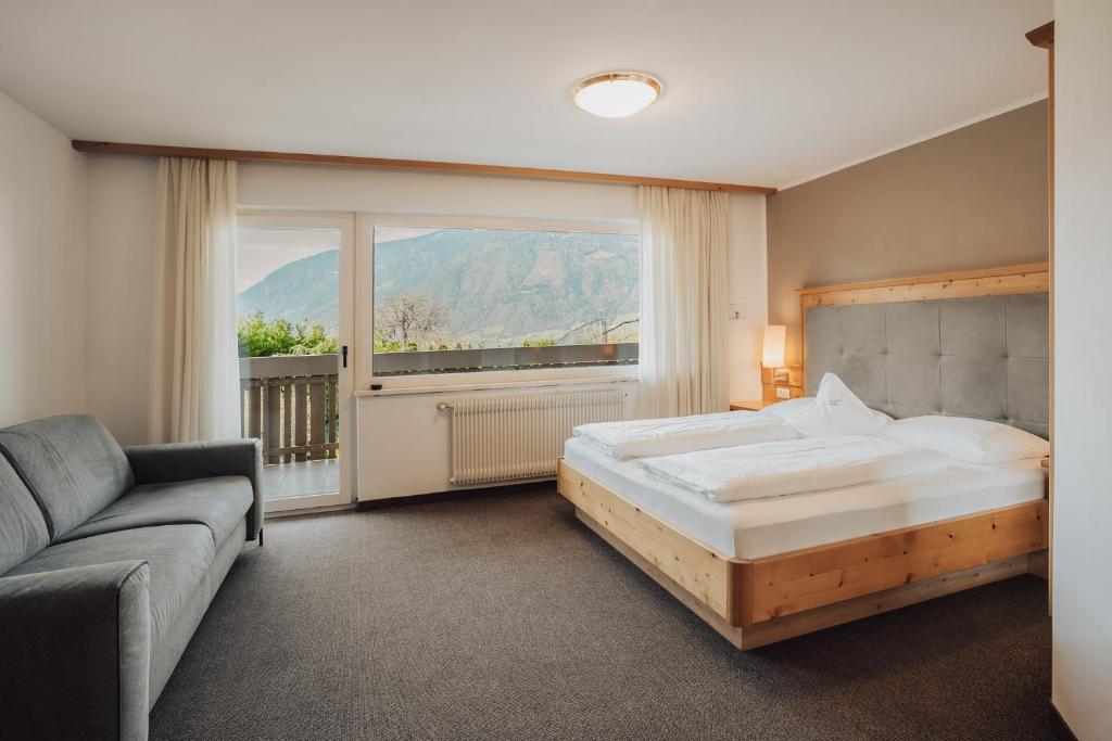 Postel nebo postele na pokoji v ubytování Hotel Lisetta
