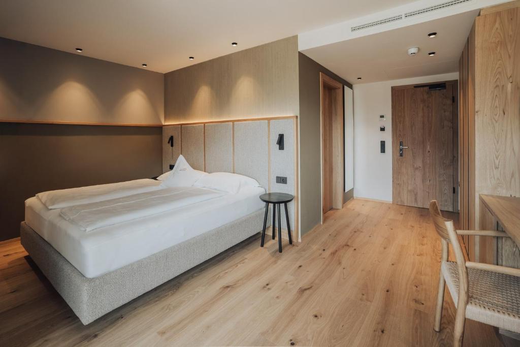 Postel nebo postele na pokoji v ubytování Hotel Lisetta