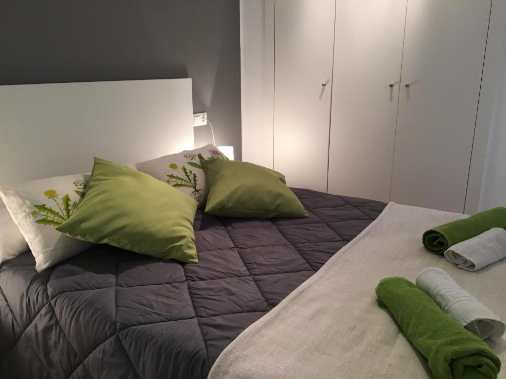 Posteľ alebo postele v izbe v ubytovaní Apartaments Muntaner I
