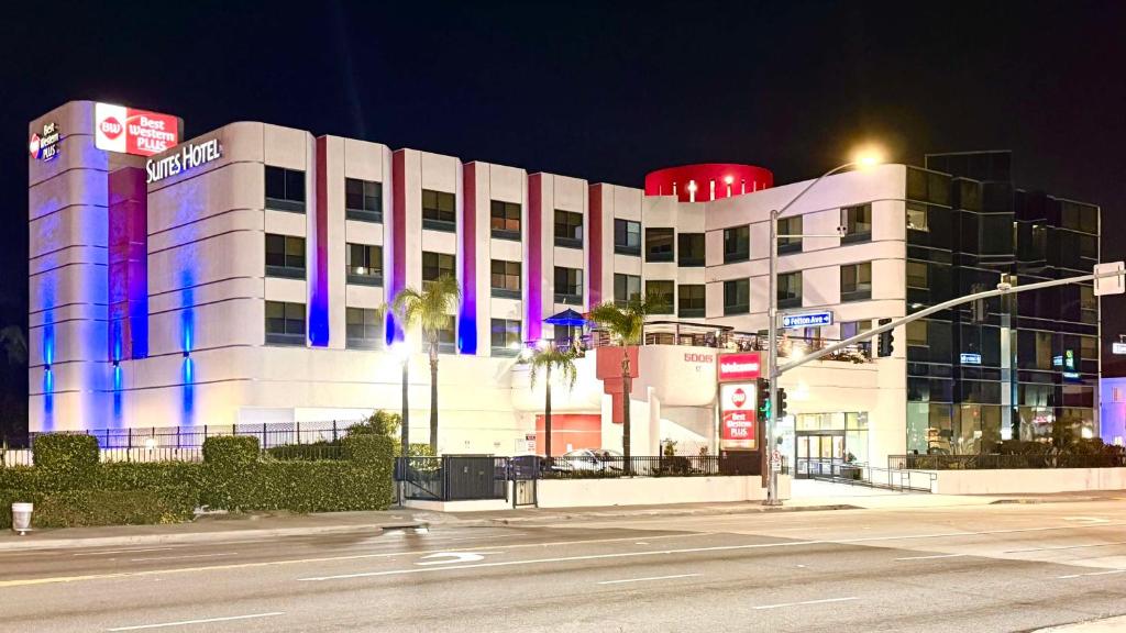 a white building with blue and purple lights on it at Best Western Plus Suites Hotel - LAX Airport LA Stadium in Inglewood