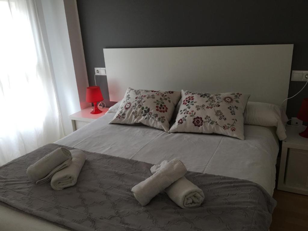 Posteľ alebo postele v izbe v ubytovaní Apartaments Muntaner I