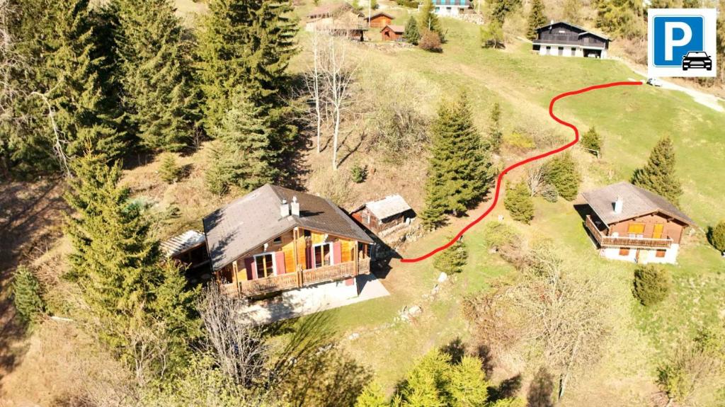 an aerial view of a house on a hill at Chalet a Didi - Alps Paradise - 4 Vallees in La Tzoumaz
