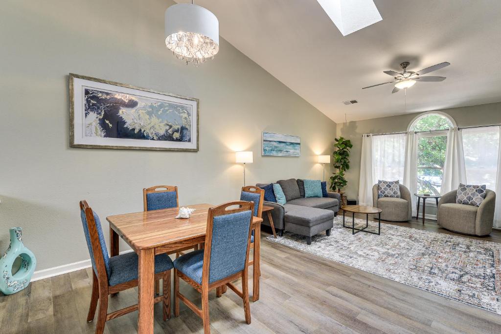 a dining room and living room with a table and chairs at Resort Condo about 2 Mi to Sunset Beach Seashore! in Sunset Beach