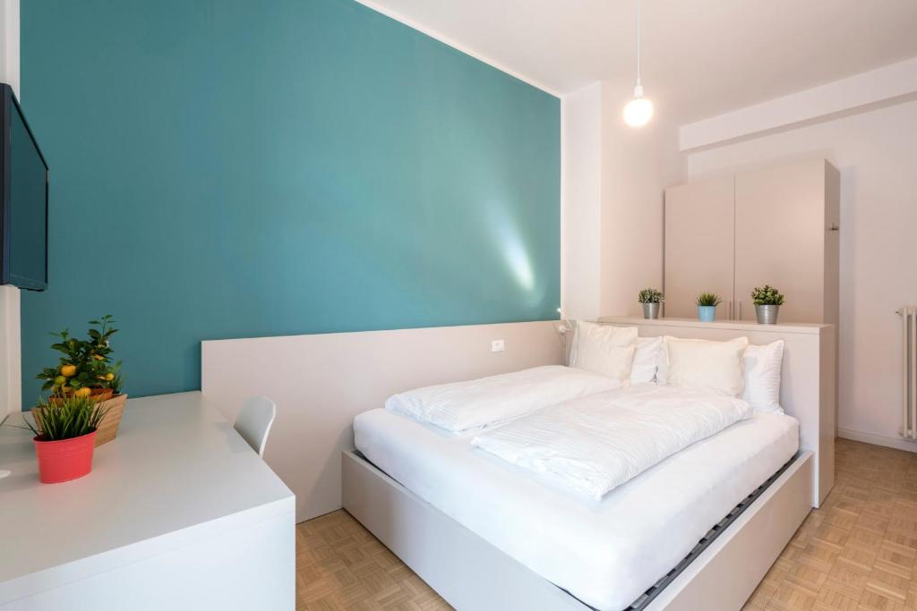 Postel nebo postele na pokoji v ubytování Stay COOPER l Capitol Rooms