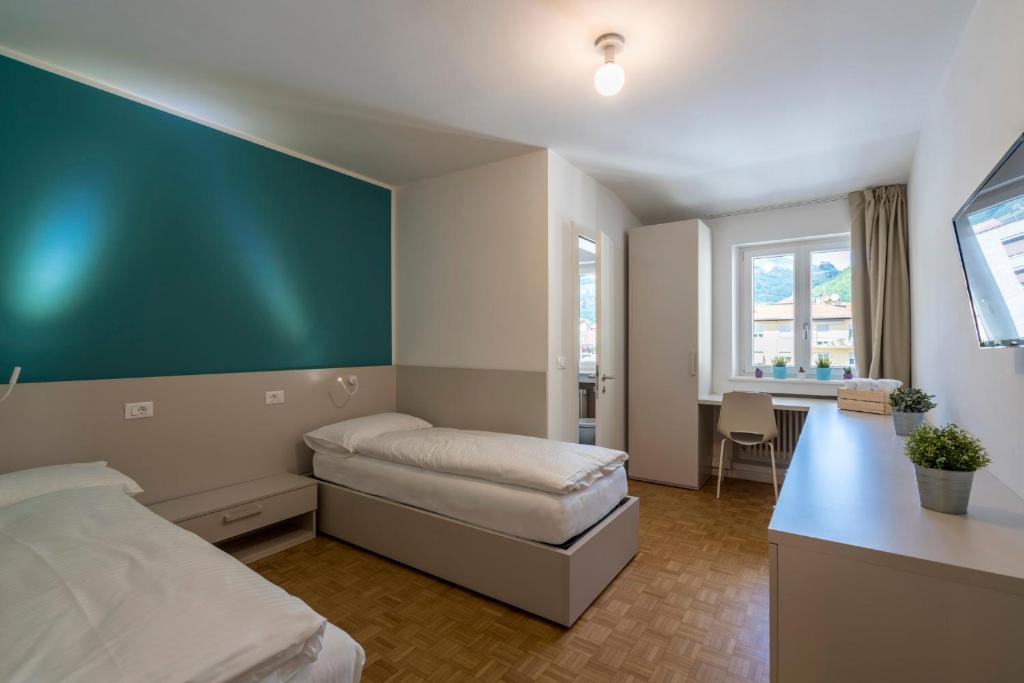 Postel nebo postele na pokoji v ubytování Stay COOPER l Capitol Rooms