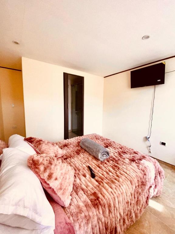 Postel nebo postele na pokoji v ubytování Hospedaje la Magia de Zipaquirá