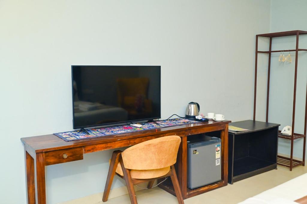 TV a/nebo společenská místnost v ubytování Seawood Beachfront resort