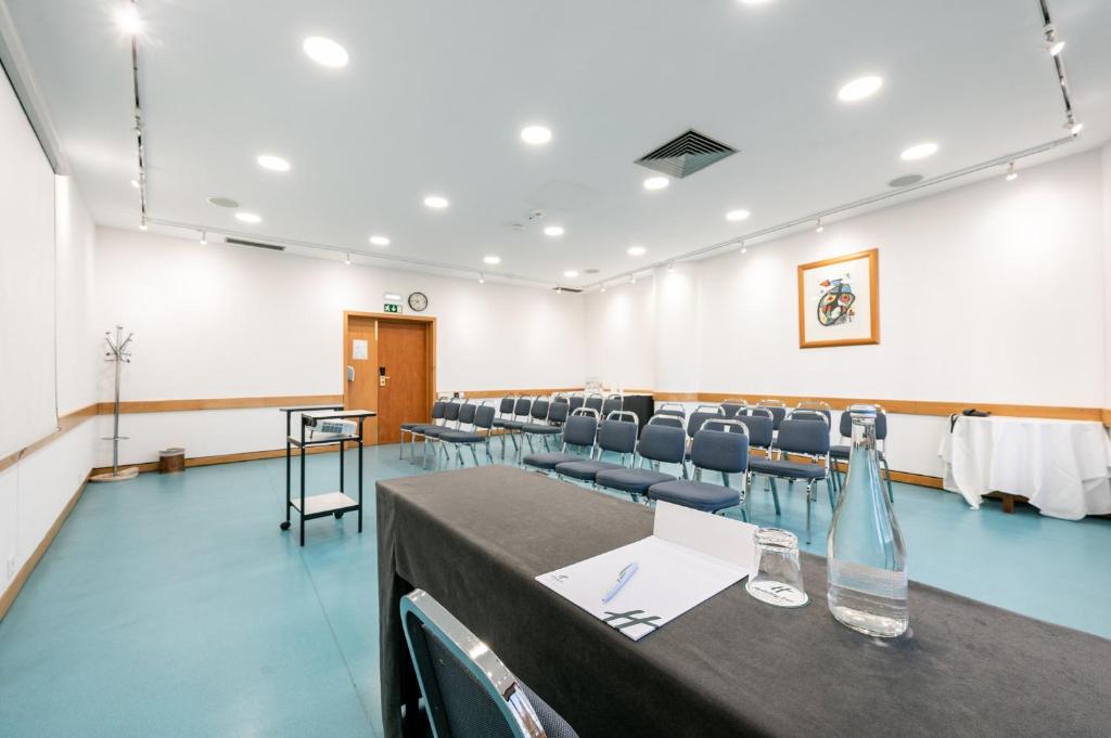 A bright conference room prepared for a presentation or training session.