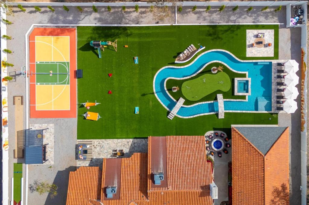 an overhead view of a playground with a swimming pool at Lazy River Luxe 6 BR Sleeps 16 Pickleball Hot Tub in Glendale