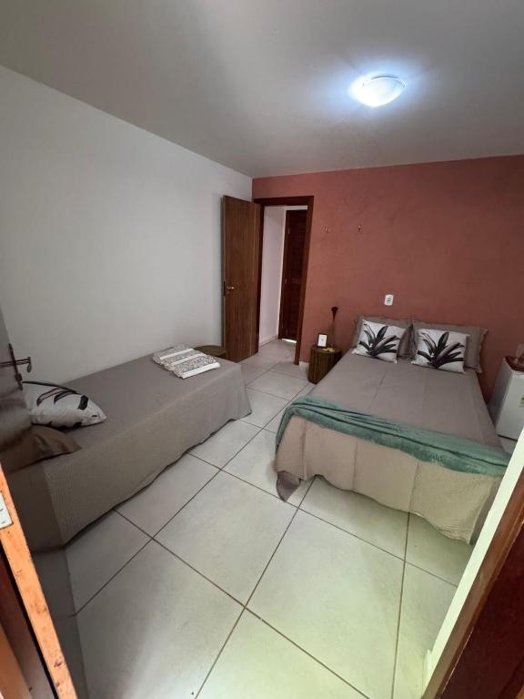 Postel nebo postele na pokoji v ubytování Chalés serra linda