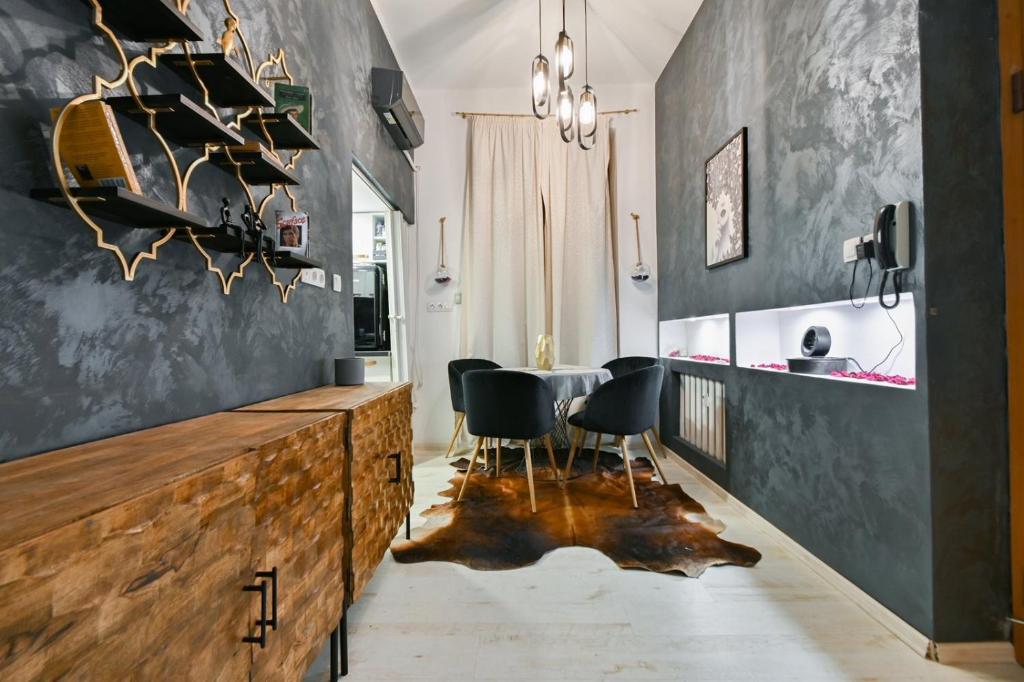 a dining room with a table and chairs at Luxory in Sofia
