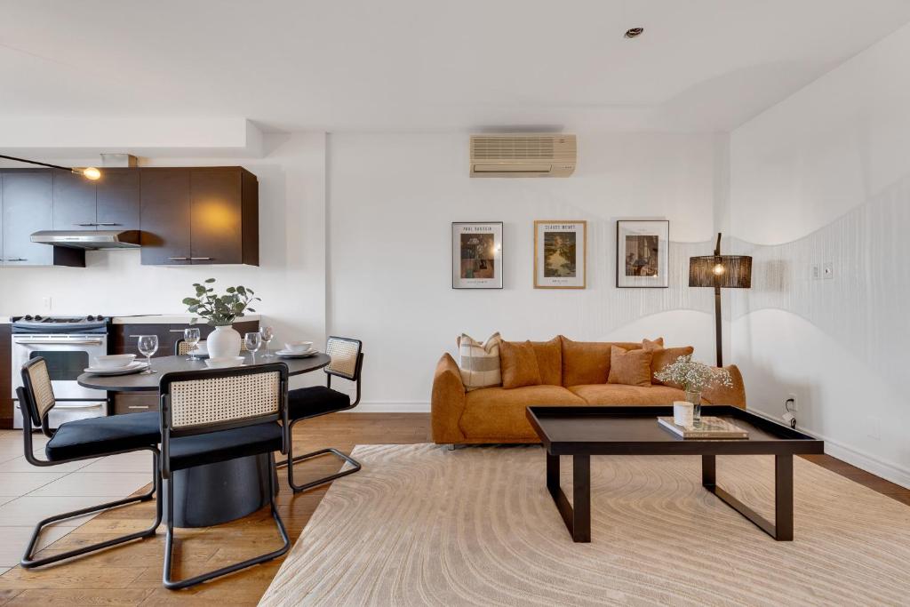 a living room with a couch and a table at Lofts de la petite Italie in Montréal