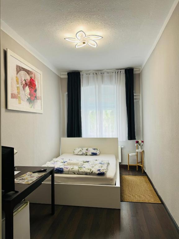 Postel nebo postele na pokoji v ubytování Apartments Oschatz