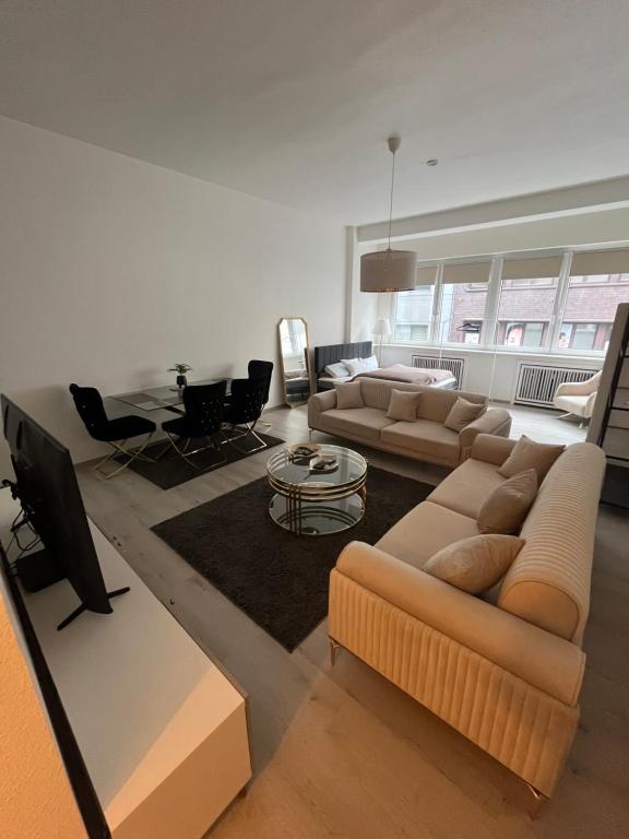 Khu vực ghế ngồi tại Modernes City Apartment am Limbecker Platz Essen