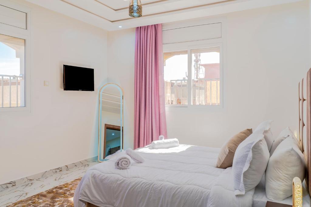 Katil atau katil-katil dalam bilik di Residence Meuble Arrahma
