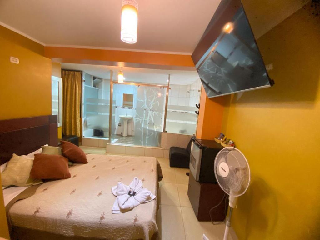 Postel nebo postele na pokoji v ubytování Hostal Milagros
