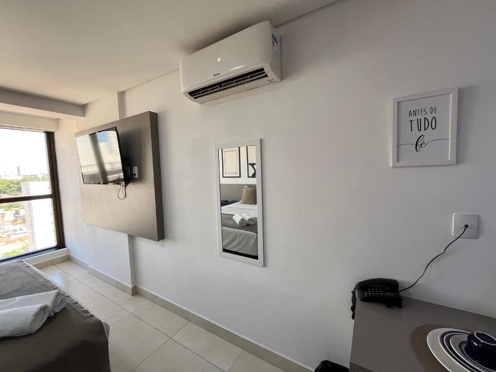 TV a/nebo společenská místnost v ubytování MANAÍRA APART HOTEL
