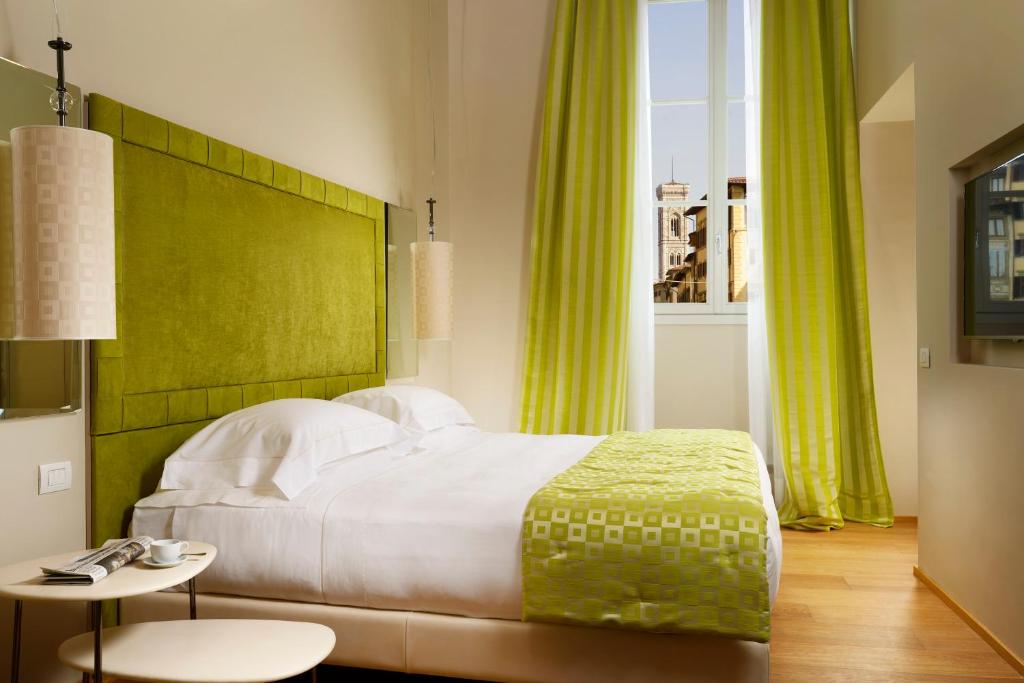 Postel nebo postele na pokoji v ubytování Grand Hotel Minerva