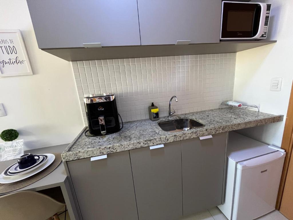 Kuchyň nebo kuchyňský kout v ubytování MANAÍRA APART HOTEL