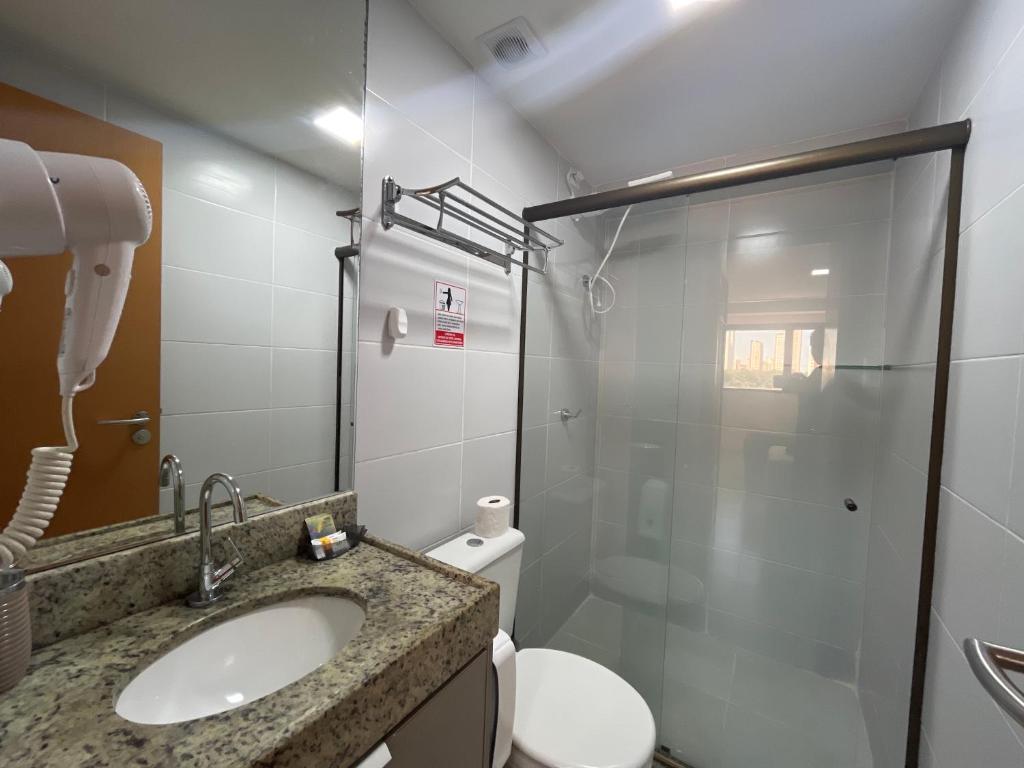 Koupelna v ubytování MANAÍRA APART HOTEL